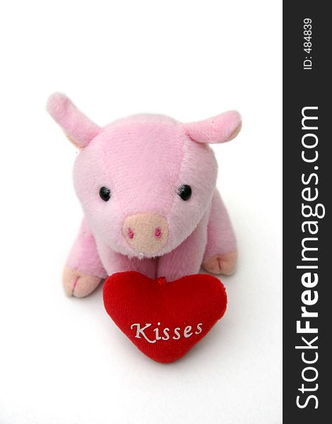 Piggy & tiny heartshaped cushion with Kisses written on it. Piggy & tiny heartshaped cushion with Kisses written on it.