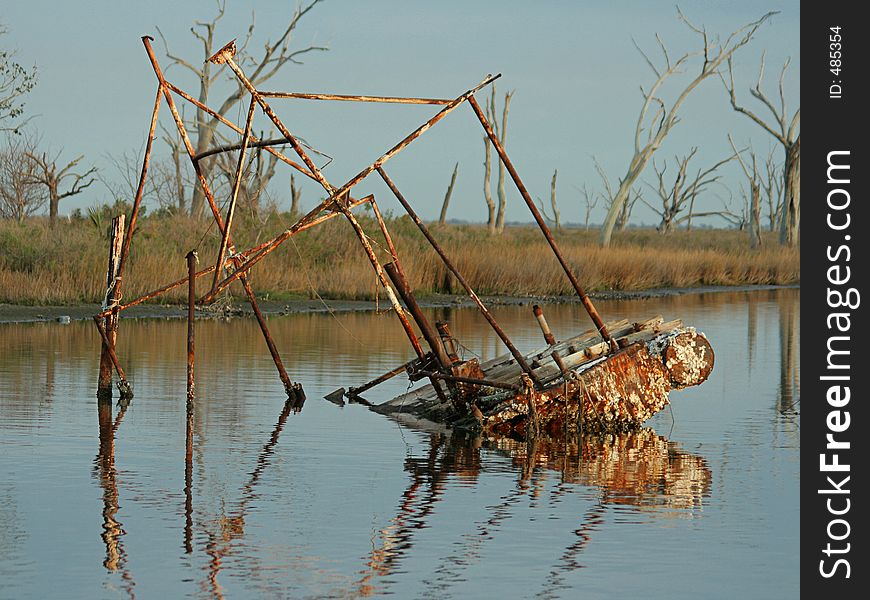 Sunken shrimp boat in bayou, Pointe-aux-Chenes, Louisiana