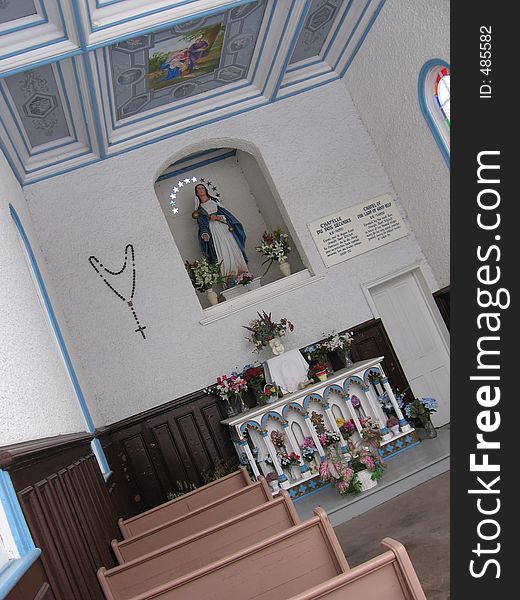 This image depicts the interior of a small church. This image depicts the interior of a small church.