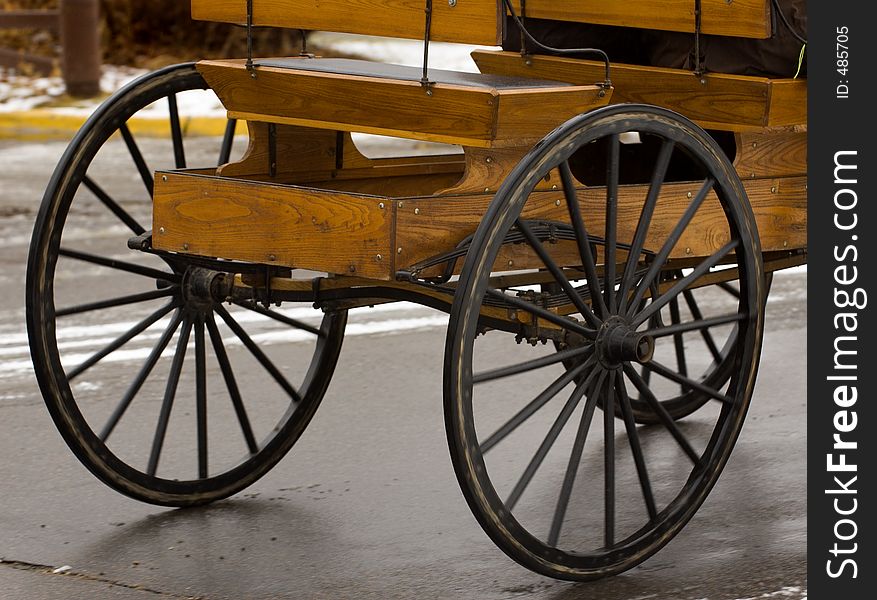 Rear end of iron wheeled horse drawn cart - Some motion blur on wheels. Rear end of iron wheeled horse drawn cart - Some motion blur on wheels