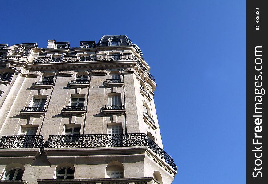 Traditional ancient building in Paris (France) on blue sky background. Traditional ancient building in Paris (France) on blue sky background