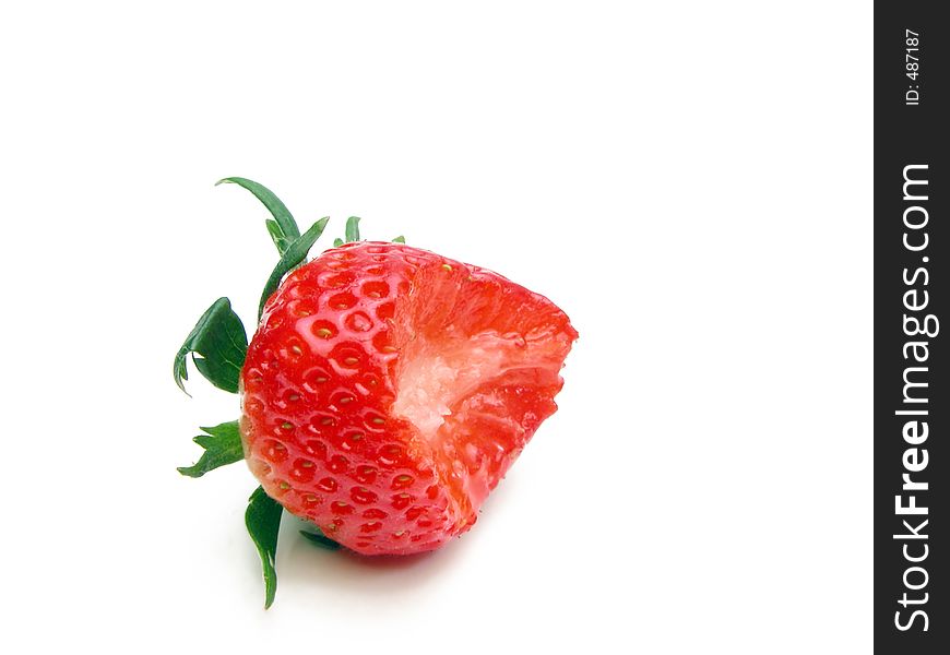 Strawberry with a bite missing over white background aith a little shadow