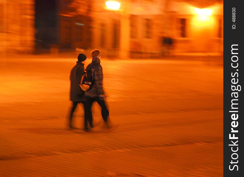 Couple Walking Over Cobblestone Pavement
