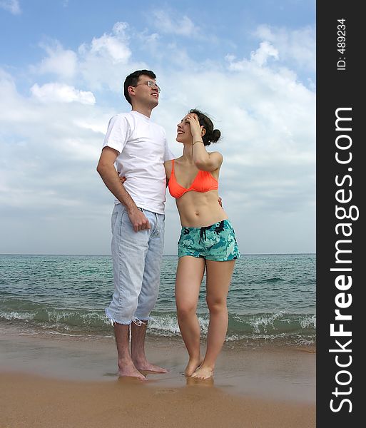 Couple stand on beach. Couple stand on beach