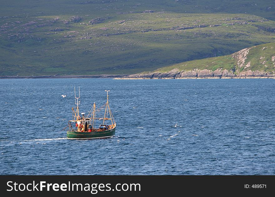 Fishing ship in a coastal landscape