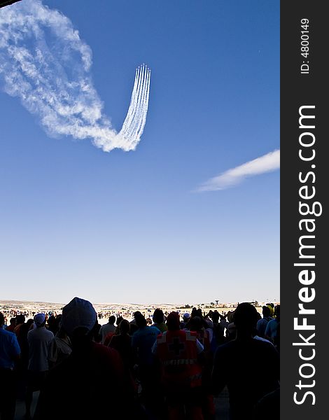 People looking aircraft show performed by Patrulla Aguila.