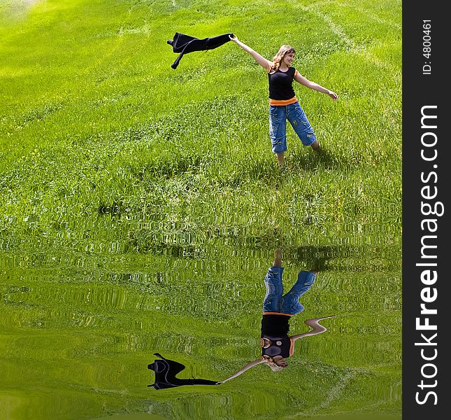 Young Woman Playing On Green Field.