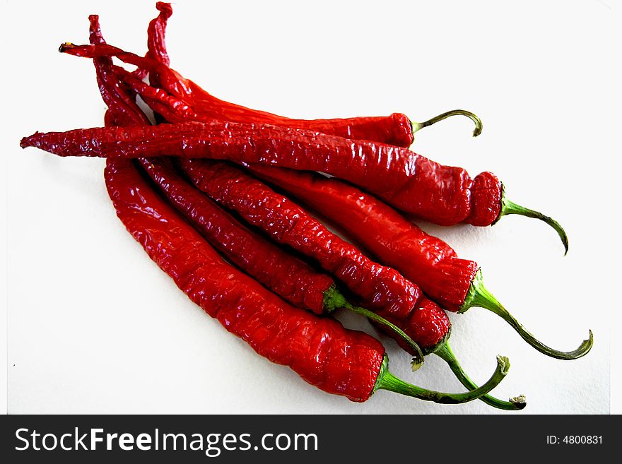 A bunch of bright red, sun dried chili peppers. A bunch of bright red, sun dried chili peppers