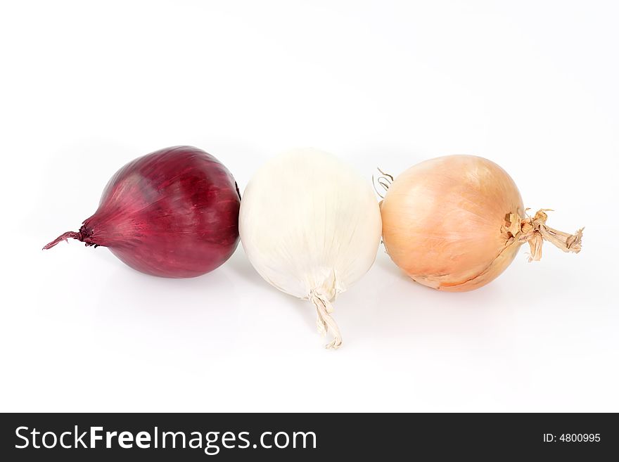 Three different colored onions on white background. Three different colored onions on white background