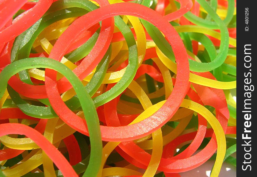 Collection of different yellow red and green rubber bands. Collection of different yellow red and green rubber bands