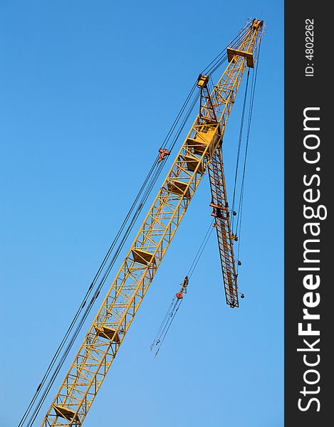 Crane with a blue sky on a background