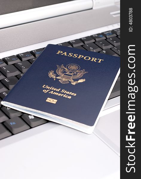 Passport on a notebook to show booking a trip. Passport on a notebook to show booking a trip