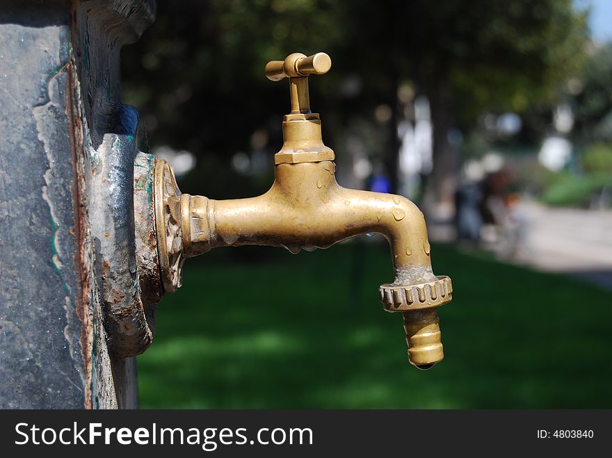 Water tap of a fountain in a park. Water tap of a fountain in a park