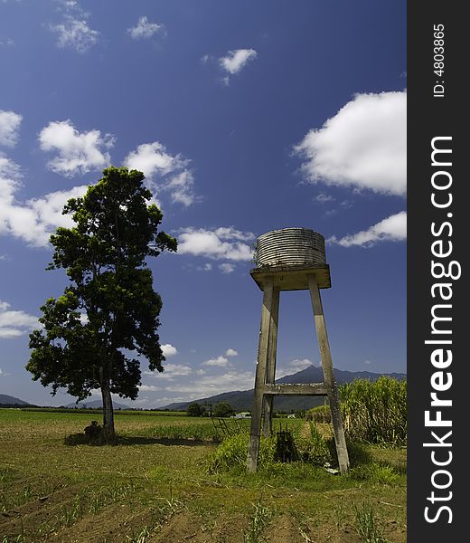 A small water tower on a sugar cane plantation in Australia. A small water tower on a sugar cane plantation in Australia.