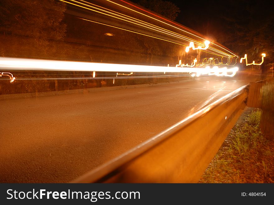 Bus lights driving through the road