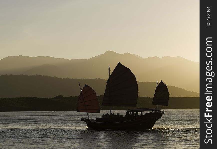 An oriental sunset cruise coming back into port. An oriental sunset cruise coming back into port.