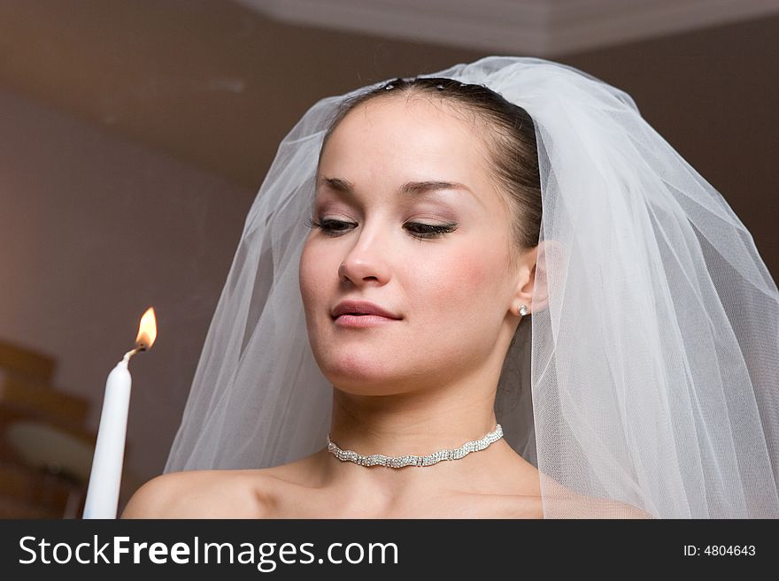 Bride with a burning candle. Bride with a burning candle