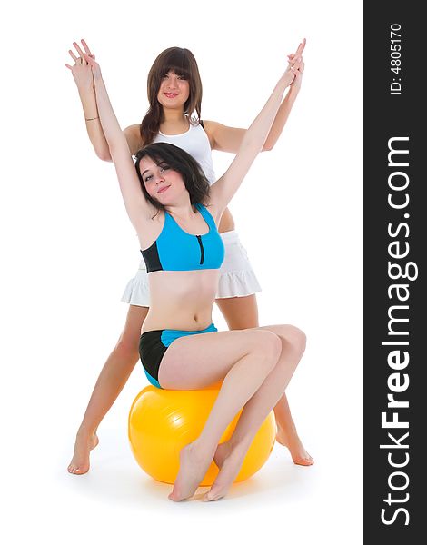 Girls practicing fitness  on  white  background