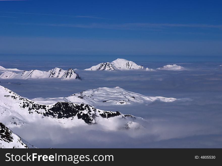 Mountain peaks above the clouds