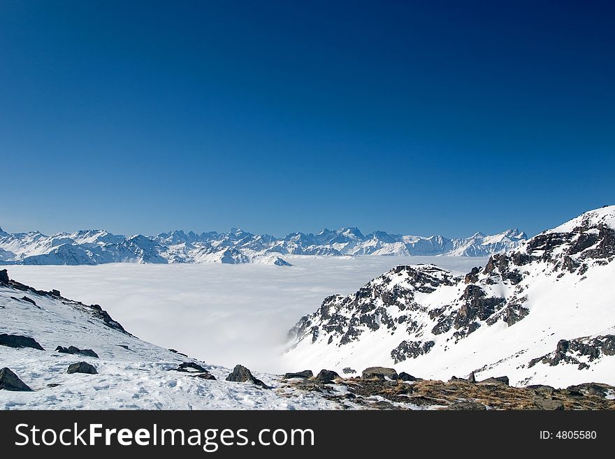 Mountain peaks above the clouds. Mountain peaks above the clouds