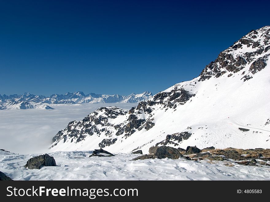 Mountain peaks above the clouds. Mountain peaks above the clouds