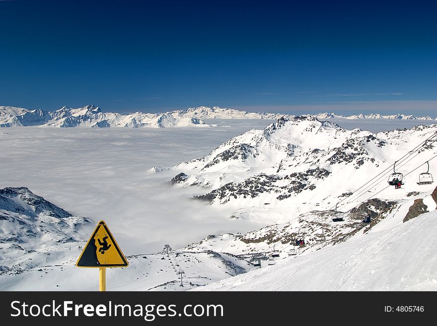 High viewpoint in the mountains, with a warning sign. High viewpoint in the mountains, with a warning sign