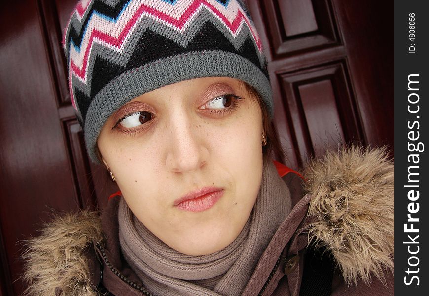 Closeup portrait of a girl in cap outdoors winter. Closeup portrait of a girl in cap outdoors winter