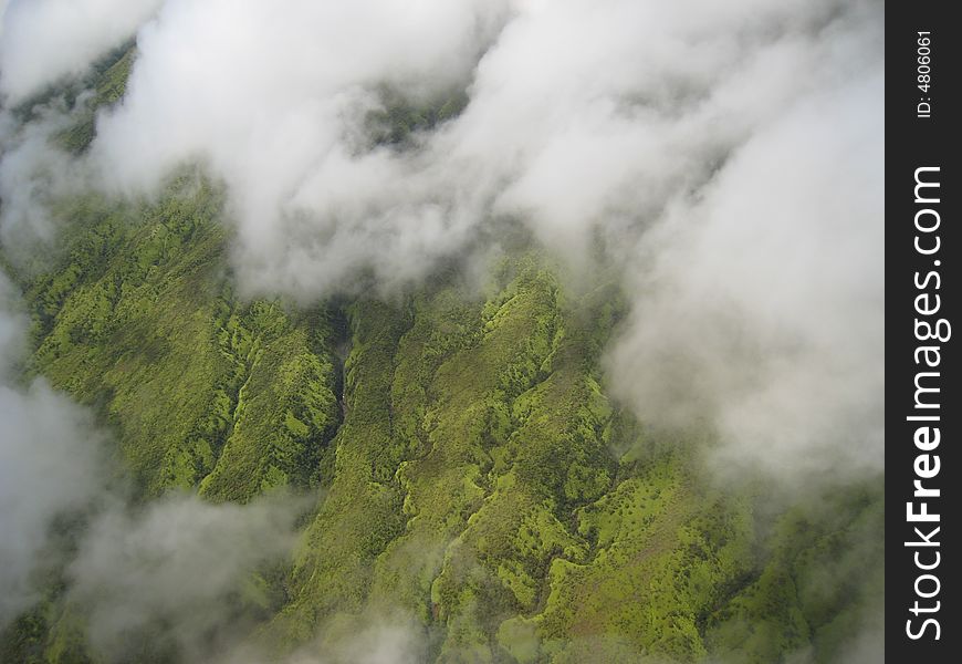 Lush green valley and clouds on the Big Island of Hawaii taken from a helicopter. Lush green valley and clouds on the Big Island of Hawaii taken from a helicopter