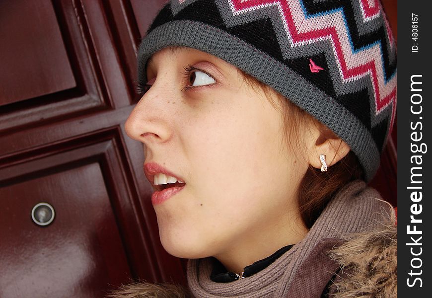 Closeup portrait of a girl in cap outdoors winter. Closeup portrait of a girl in cap outdoors winter