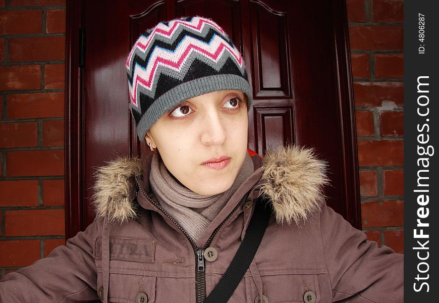 Closeup portrait of a girl in cap outdoors winter. Closeup portrait of a girl in cap outdoors winter