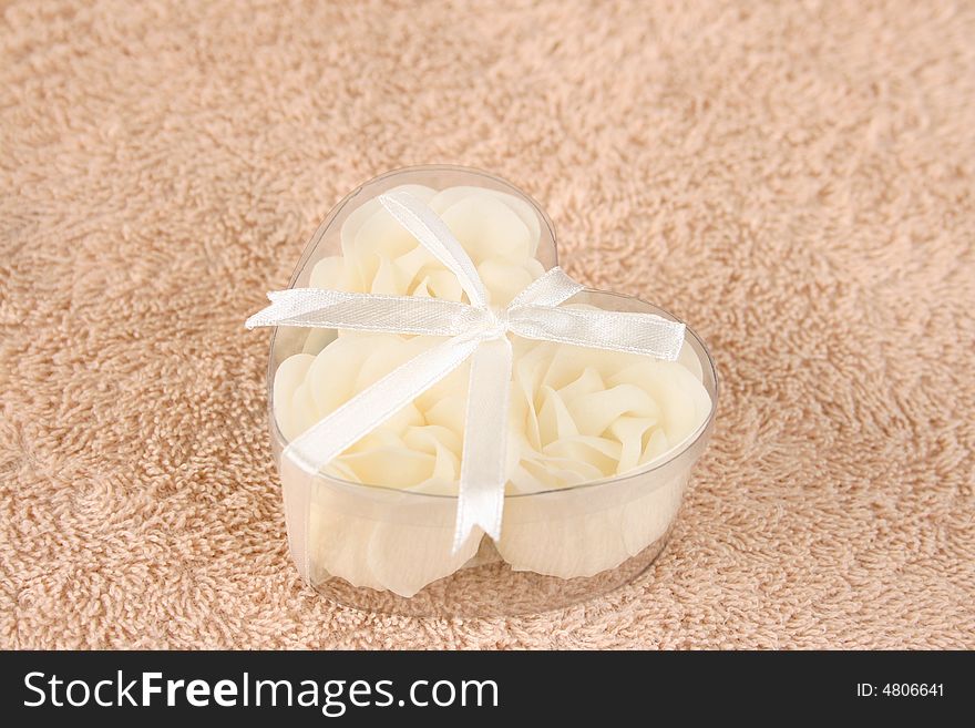 Cream colored flowers made from soap in a container. Cream colored flowers made from soap in a container