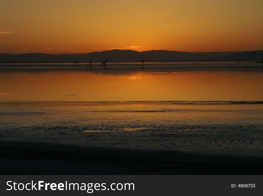 Golden sunset at Salton sea lake