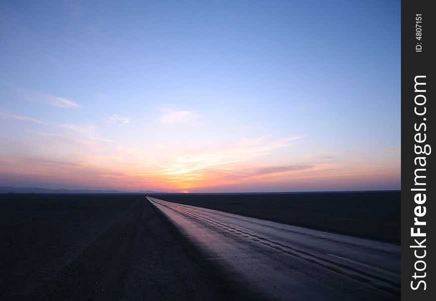 Sunset of Dunhuang, west deserts, Road lost at apparent horizon, Dunhuang, Gansu, China