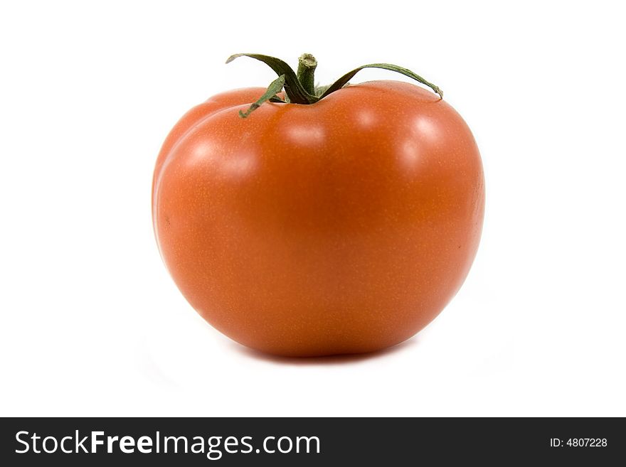 Red shiny single tomato isolated on white