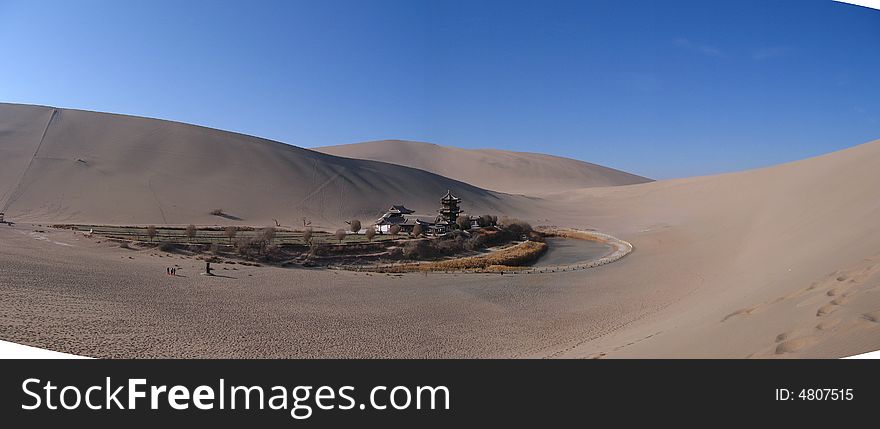 Yueyaquan, a famous little lake in desert, The figure of the lake like the Moon, West, dunhuang, gansu, China. Yueyaquan, a famous little lake in desert, The figure of the lake like the Moon, West, dunhuang, gansu, China