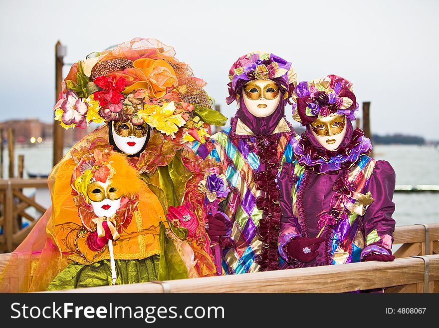 Three people in costume at the Venice Carnival. Three people in costume at the Venice Carnival