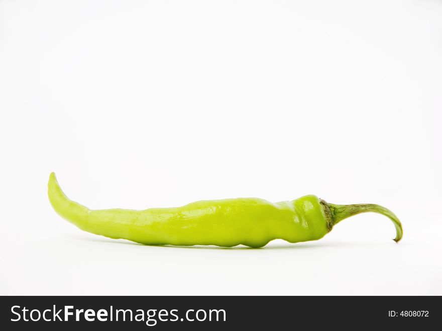 Chili green pepper on white background, shallow DOF