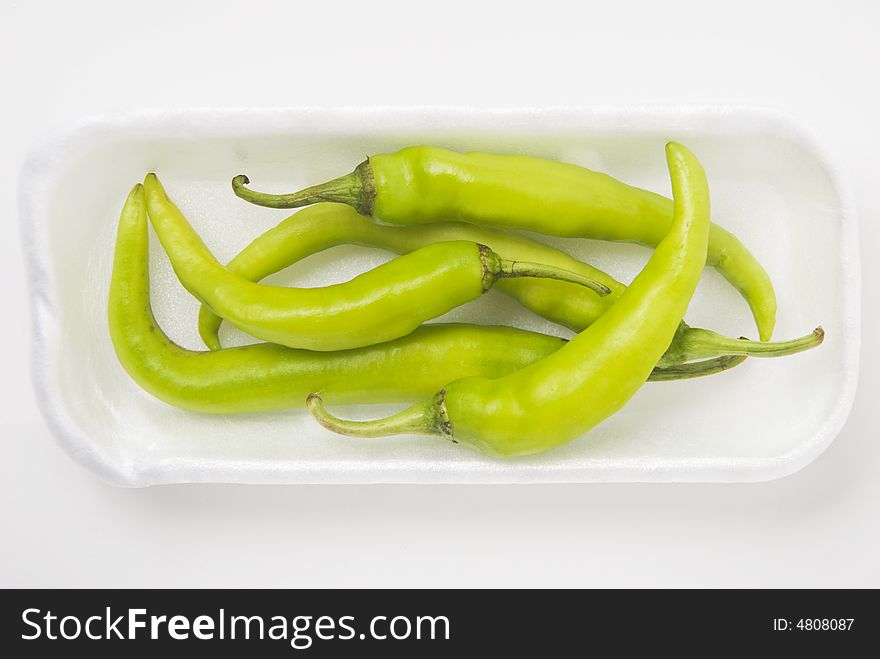 Chili green pepper on white background, shallow DOF