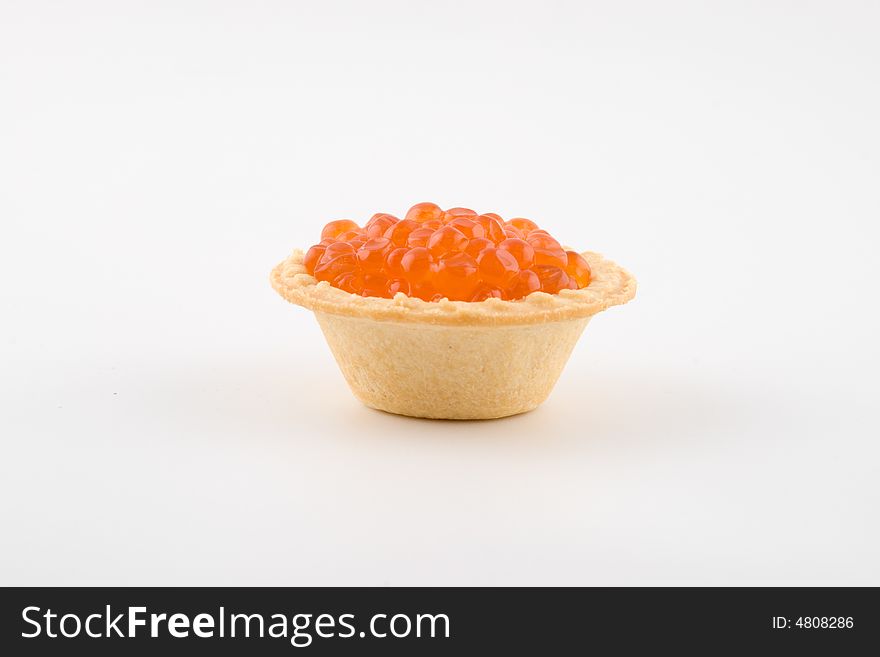 Tartlets with red caviar isolated on a white background. Tartlets with red caviar isolated on a white background