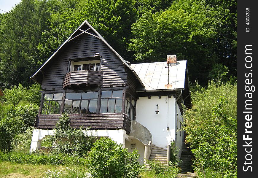 Old style house at the edge of the forest. Old style house at the edge of the forest.