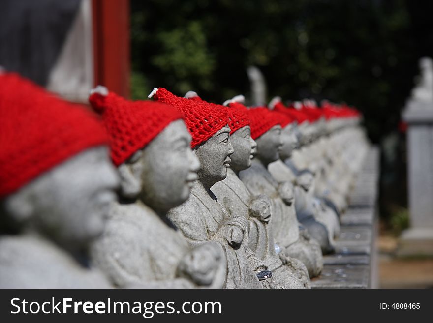 Statuary with red hat