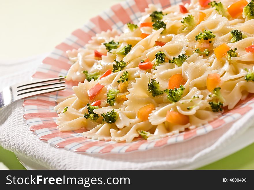 Macro picture of appetizing cooked pasta with vegetables