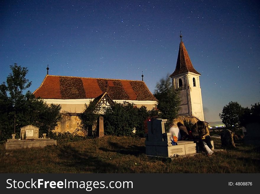 Lutheran church by night visited by some youngsters