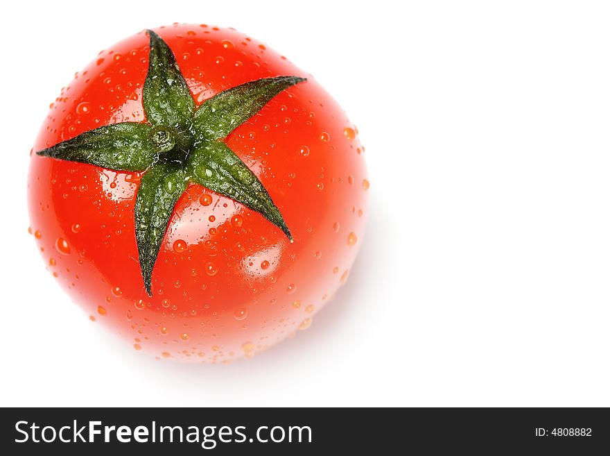 Fresh tomato with dew isolated on white