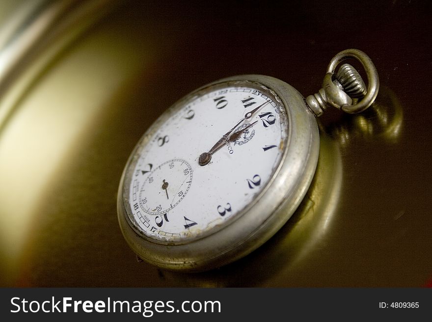 Close-up of vintage pocket-watch showing almost midnight. Close-up of vintage pocket-watch showing almost midnight