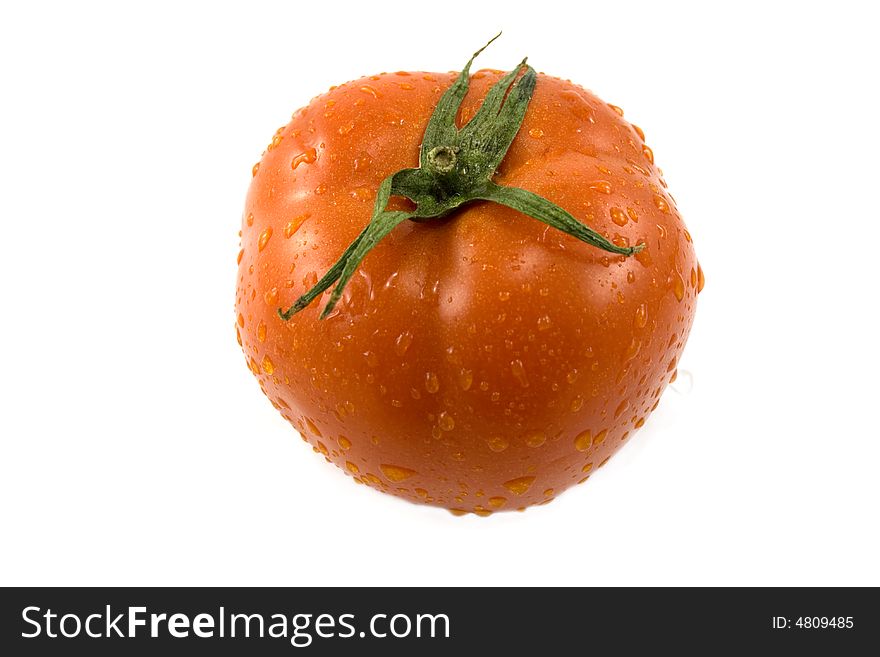 Red fresh tomato with drops isolated on white