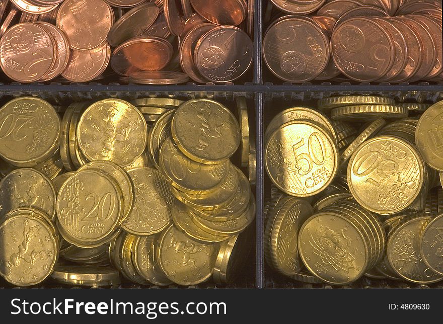 Euro coins divided into various denominations. Euro coins divided into various denominations