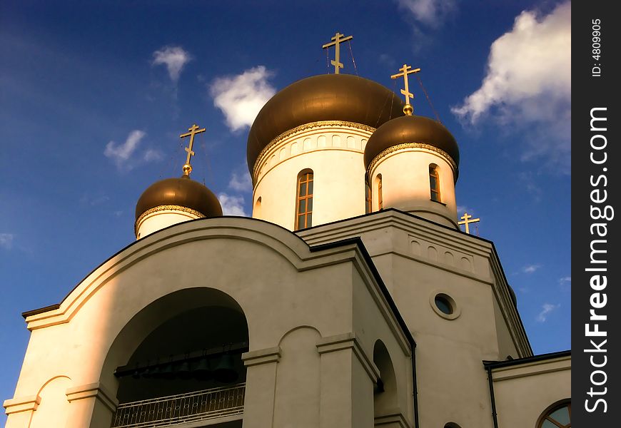 Evening Spring. Cupola churches and crosses against the backdrop of the sky.