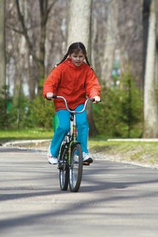 The Girl-teenager On Park On A Bicycle (2) Stock Photos The Girl-teenager On Park On A Bicycle (2) Stock Photos