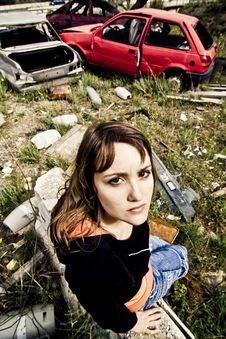Young Woman In The Scrapyard Stock Images